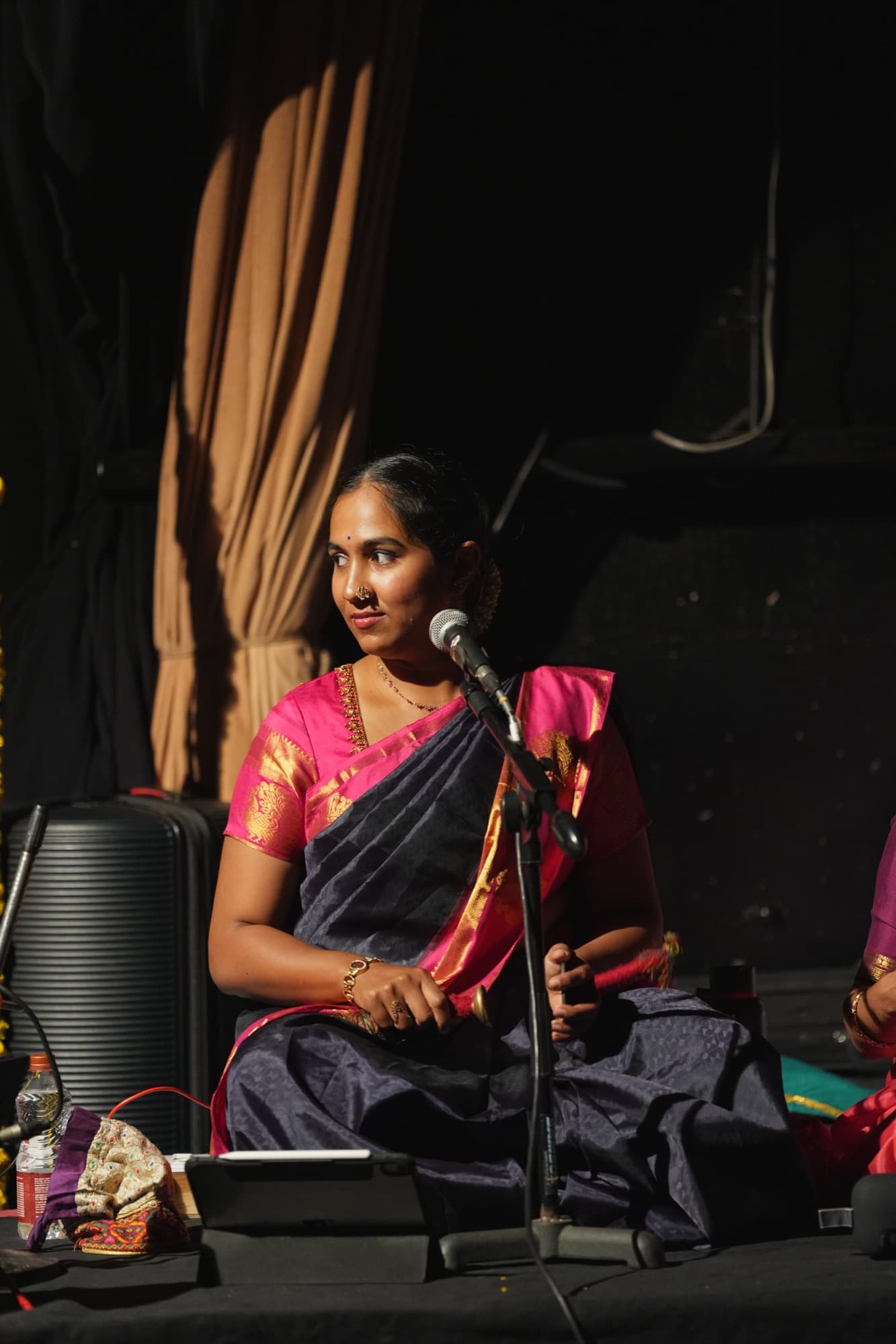 Carnatic vocalist performing on stage