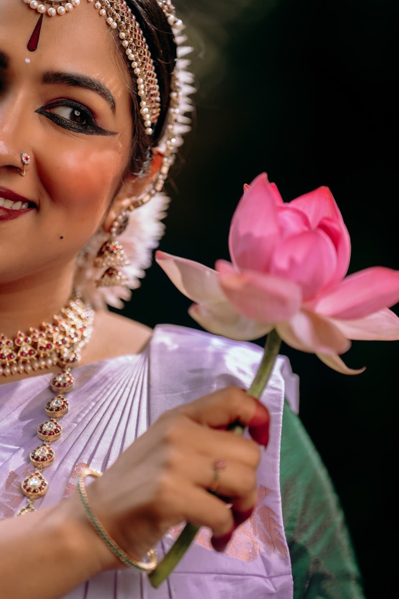 Bharatanatyam dancer holding a lotus, Anura Academy